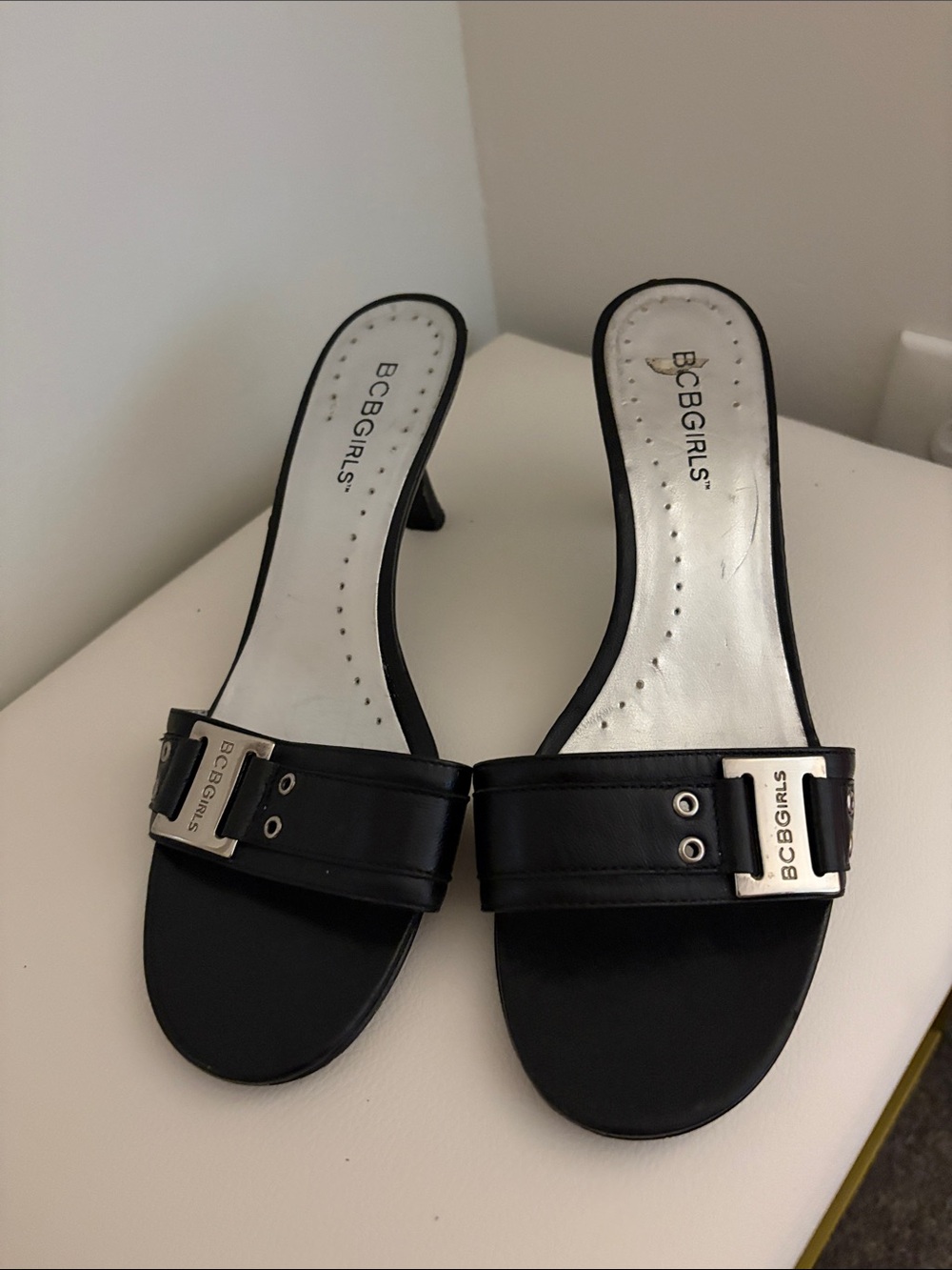 BCBGirls Black Slide Heels with Buckle Accent